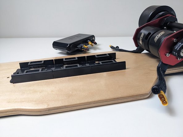 Install your board's ESC to the rail by sliding the ESC's bottom onto the rear-rail.