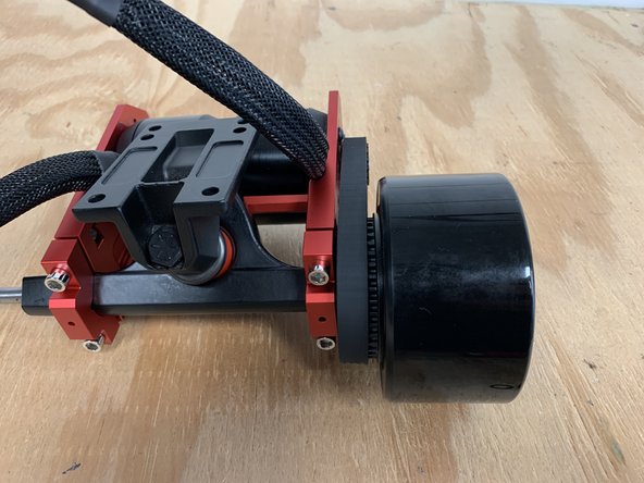 Slide the wheel onto the truck with the words facing outwards