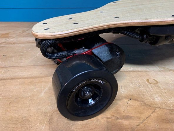 Place the belt guards on the motor mounts and tighten the four screws