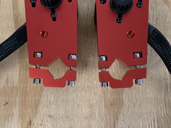 Use the 5mm Allen wrench to loosen the motor mount bolts