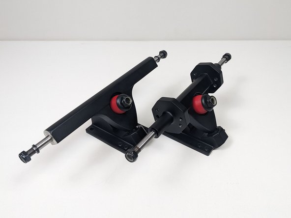 If your having trouble getting the locknut to start threading, make sure the hanger is pushed all the way into the base of the baseplate (where the hanger comes to a rounded point). You can also apply pressure down on the truck to compress the bushing