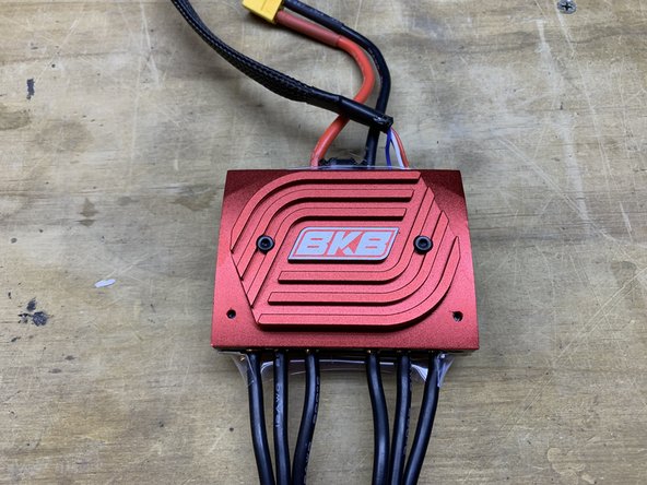 Remove the two M3 bolts securing the heatsink to the VESC