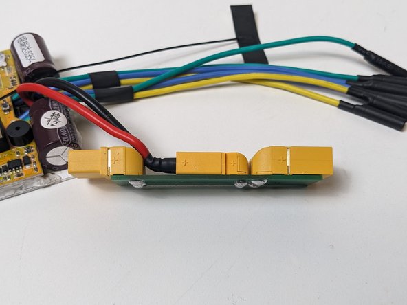 While pushing the connectors together, you can push down to bend the ESC cables to fit into the space between the XT90's.
