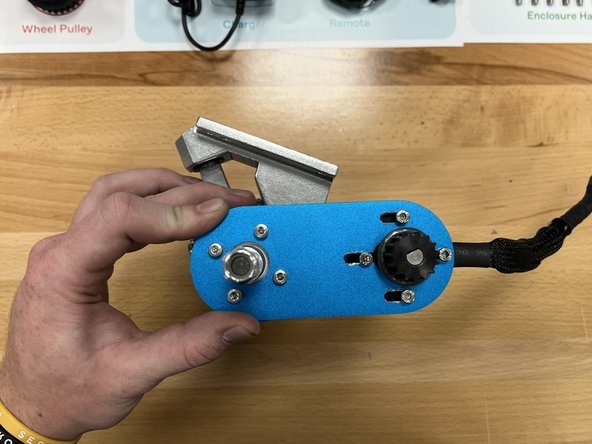 Add the 4x long motor hardware bolts from section 3 to the motor mount