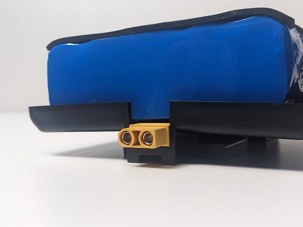 Ensure that the PCB is seated securely on these pegs. The second image demonstrates the correct fitment