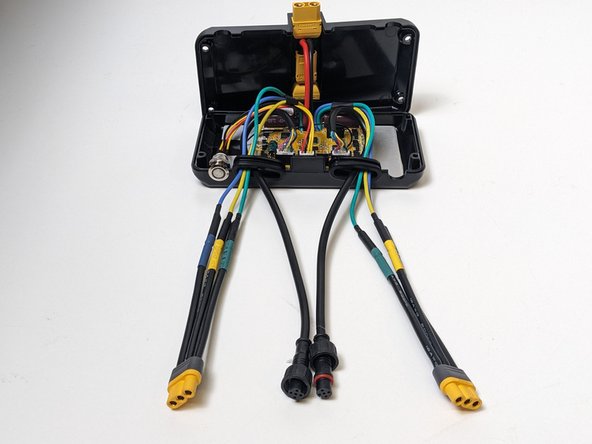 Slide the Rubber Cable Gaskets up the cables to the cable cutouts on the ESC enclosure.
