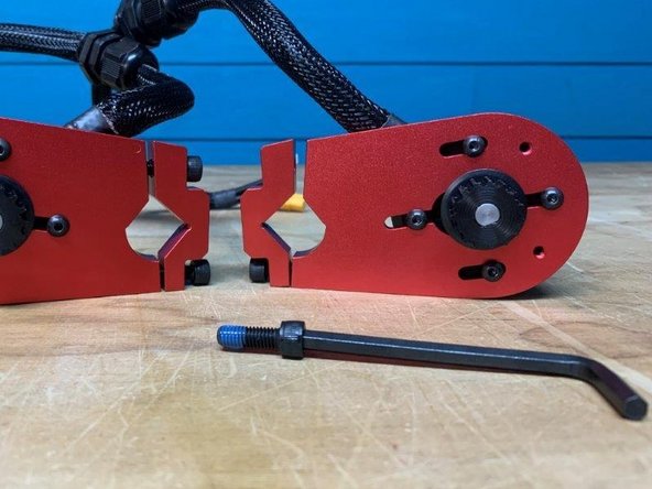 Remove the 2x M6 bolts that fasten the motor mount to the truck.