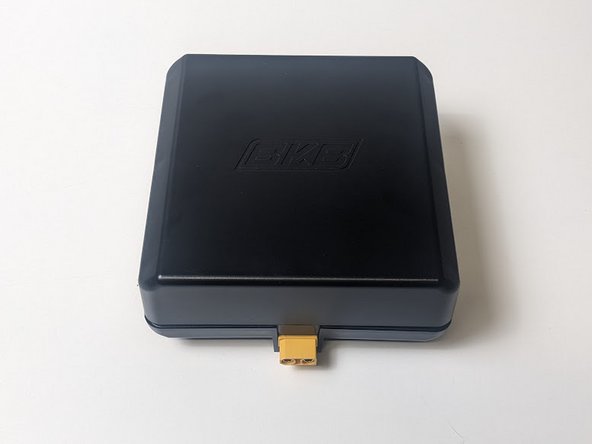 Place the casing cover over the battery