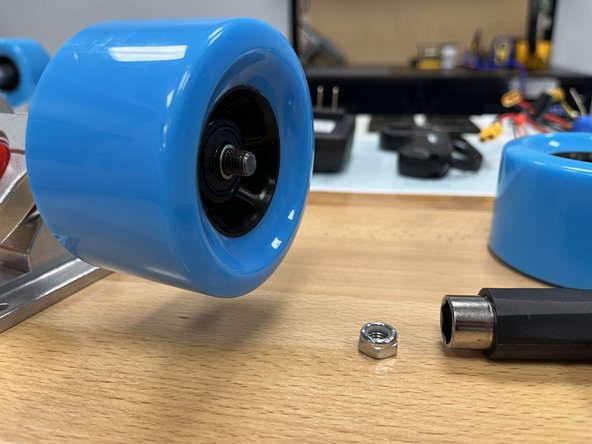 Place the other silver spacer onto the hanger