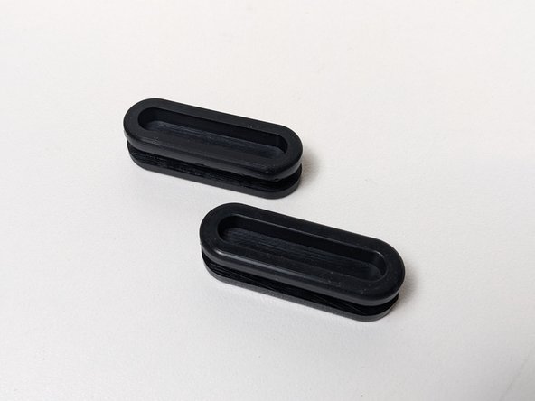 Grab two of the rubber cable gaskets.