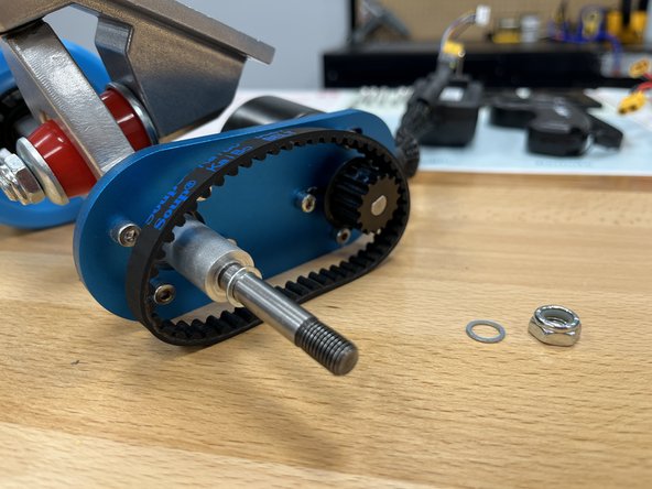 Place the belt over the motor pulley as shown