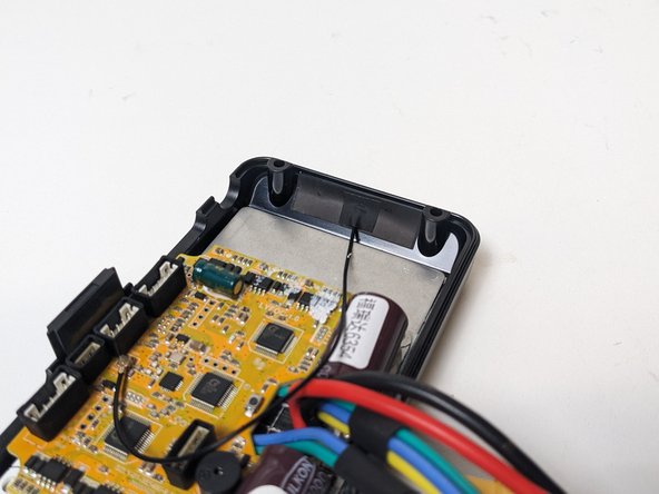 Locate the remote's receiver, which is a small black wire with a black rectangle sticker at the end of it.