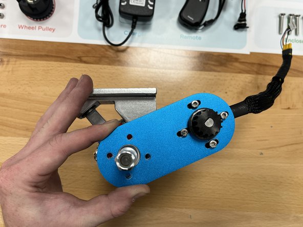 Place the motor mount onto the rear hanger and align the mounting holes as shown