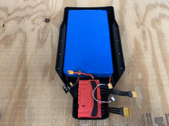 Place the battery inside the enclosure