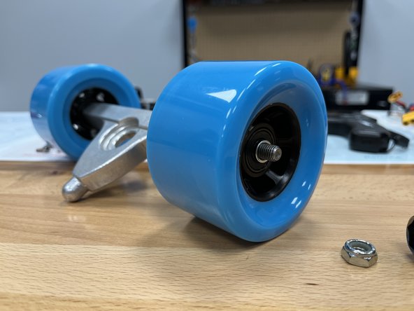 Slide the silver spacer back onto the hanger