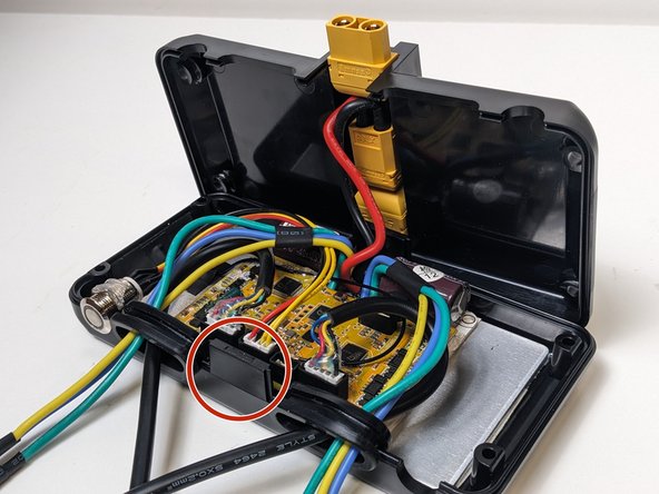 With your wire's properly tucked. and managed, it's time to connect both sides of the ESC's enclosure.