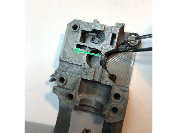 Slide sensor lever into extruder body.