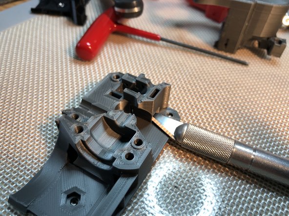 Lap rear surface of Extruder Body to flatten its x-carriage mating surface.