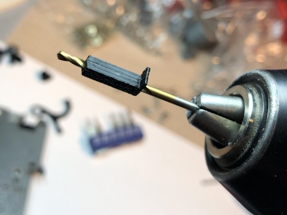 Use 2 mm drill to clear screw bore of optical interruptor bar. M2 Screw must readily slip through the bore.