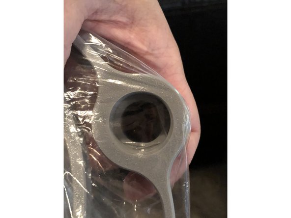 Flatten plastic bag over threaded port.