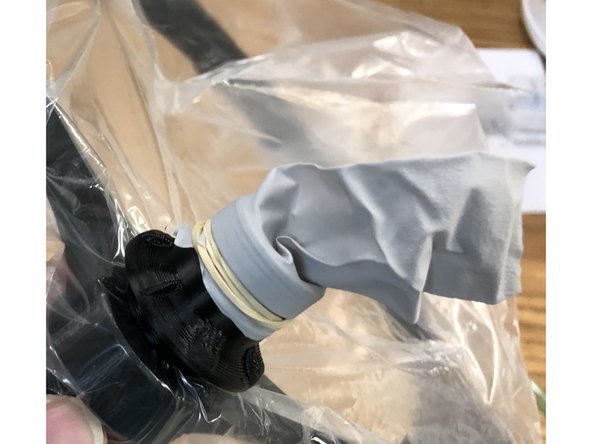 Flutter valves are fashioned from a cut-off glove finger rubber banded onto Flutter Valve Penetrator. End of finger is cut to allow air exit, but reverse flow is immediately stopped.