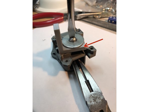 Use M5 bolt,  two washer, and a nut to draw in bearings. Resistance to bearing insertion should be moderate. If you find yourself torquing bolt hard, something is awry. Remove the bearing and recheck for stray filament bits