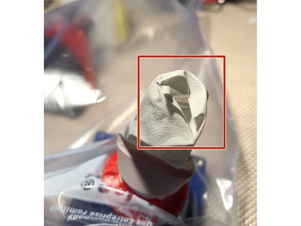 Cut one of the longest fingers from glove. Select one that is free of wrinkling and creasing near its tip. If the tip has severe creasing or wrinkles, the valve will never shut properly. 2nd pict shows the badly wrinkled end.