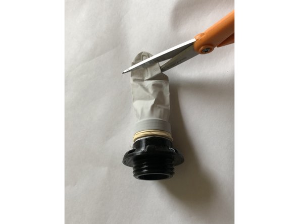 Use the longest longer finger from glove and stretch its open end over flutter valve fitting.