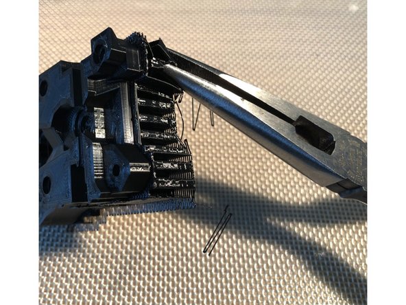 Motor plate has four M3 bolt holes that are printed with a thin, sacrificial membrane to improve print geometry. Clear out the holes with 3 mm drill.