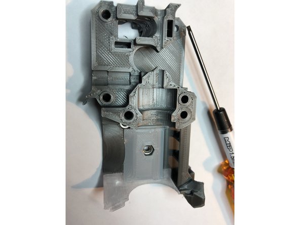 Two M2 x 12 mm screws attach hot fins to extruder body