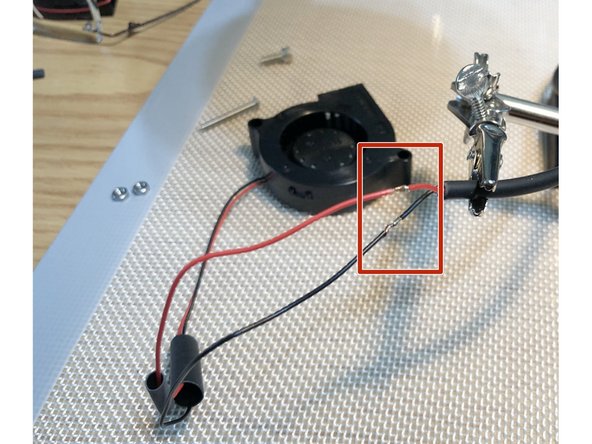 Solder fan leads to cable.