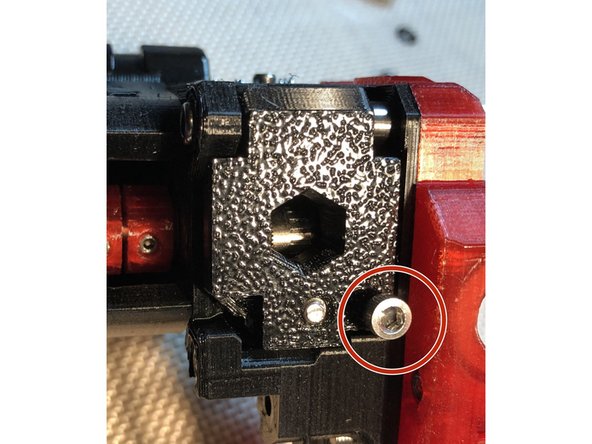 In this step, we adjust the filament sensor to reliably detect presence of filament between Bondtech gears. Idler door must be tensioned during adjustments.