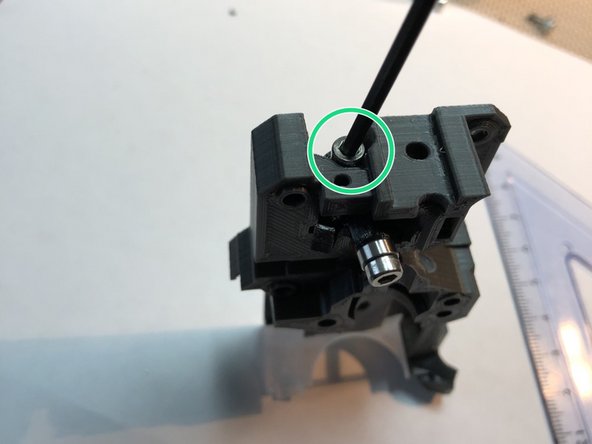 Secure through pivot bearing with M3 x 8 mm screw. Be gentle. This screw threads directly into plastic.