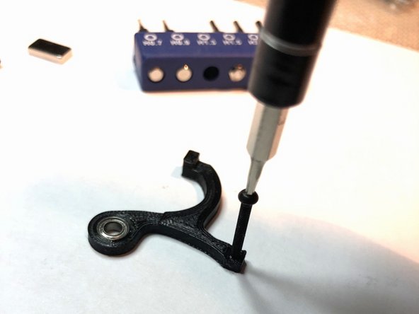 M2 black alloy screw will be used to mount optical interruptor bar on lever at 90 degrees. Pre-threading the mounting hole makes things easier later.
