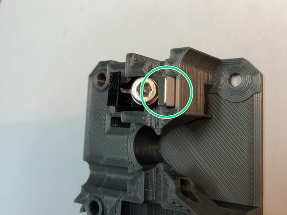 Insert small, 5 x 10 x 2 mm magnet, from Prusa MK3S sensor system,  into pocket right of armature