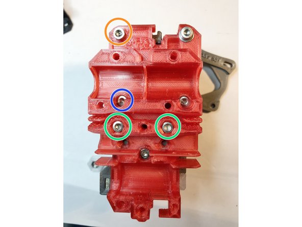 Insert two M3 x 12 extruder body mounting screws, but leave them slightly loose.