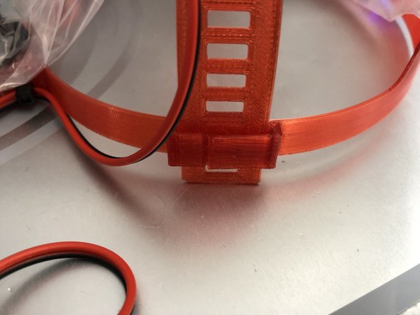 B4 and later Bunny PAPRs  have slots that accept the fan bands. Simply insert until band clicks in desired position.