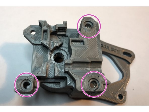 Three regular M3 nuts and one M3 Nylock must be installed.