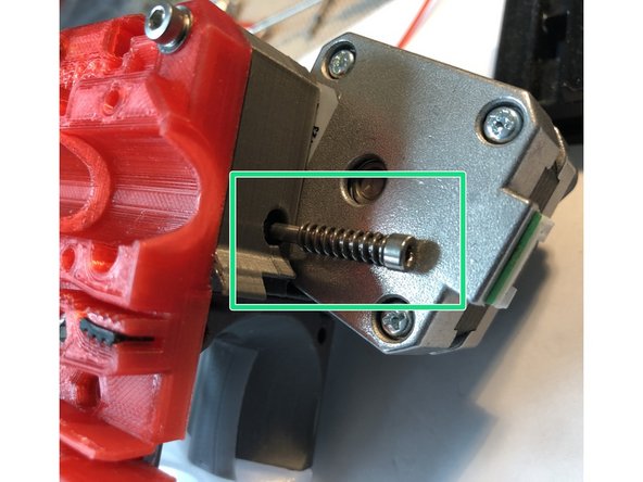 Insert idler door tension adjust screw and spring. Only one screw and spring are used in BNBSX.
