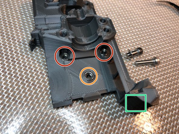 Install three M3 nuts. These will attach extruder to x-carriage.