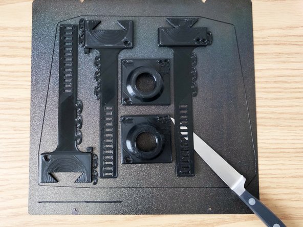 Fan mounting bands have long thin portions. Simply popping off part by flexing plate can fracture the bands near the thicker portion of part.