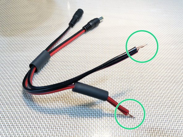 Place smaller tubing over just positive fan lead