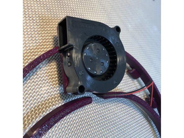 Older, dual loop Halos mount their fans on forward plate. Newer Flex Fit versions have fan on a banded mount.