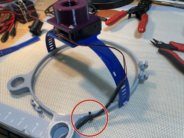 Flex fit version has only one loop and a zip tie channel molded into it.