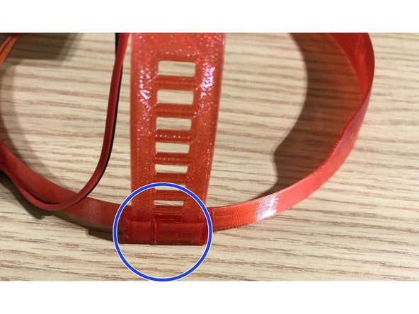 Band inserts into mounting slots on each side of loop. Insert into slot and click to desired height.