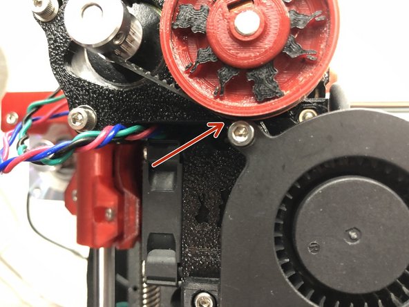Use two M3 x 18 mm screws and LOOSELY attach parts cooling cooling fan. You can add a M3 washer to lower right screw, but not to top screw.
