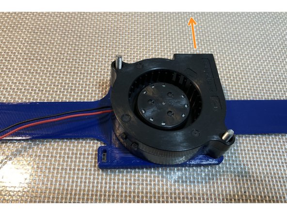 Arrow indicates forward direction for airflow and fan outlet.