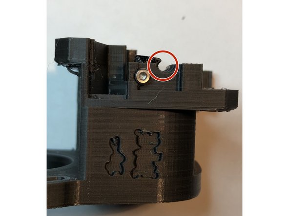 Position the filament path insert into motor plate. It is easier to handle with tweezers.