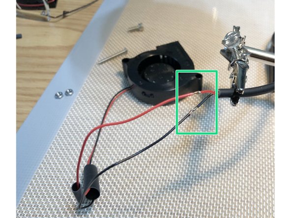 Solder fan leads to cable.