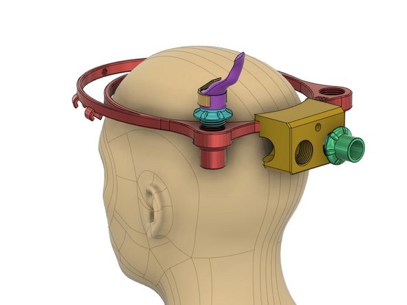 External Air Connector block attaches to halo via an M3 nut and bolt. A 22 mm penetrators creates inspiratory port for incoming, clean air. Surgical mask should also be worn.